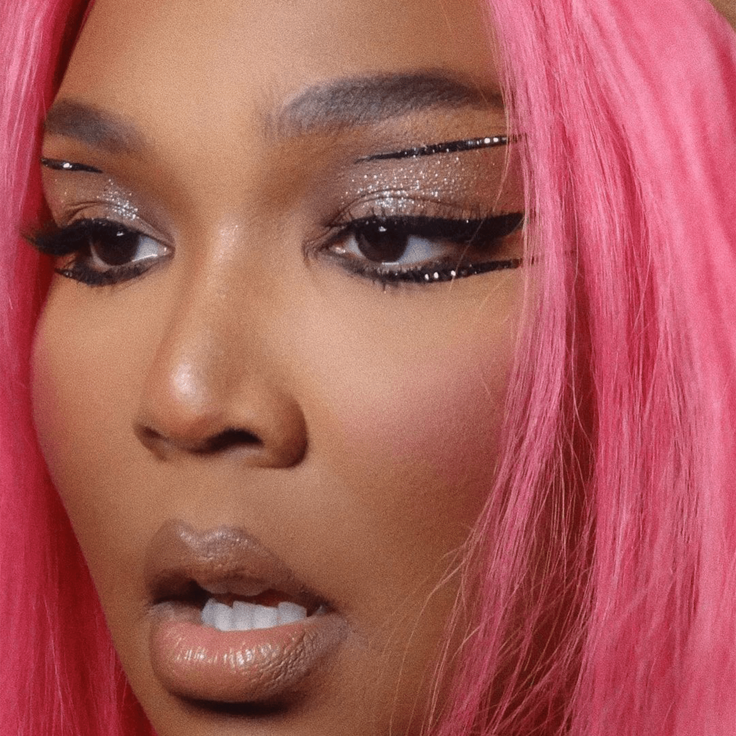 Lizzo wearing black glitter eyeliner 