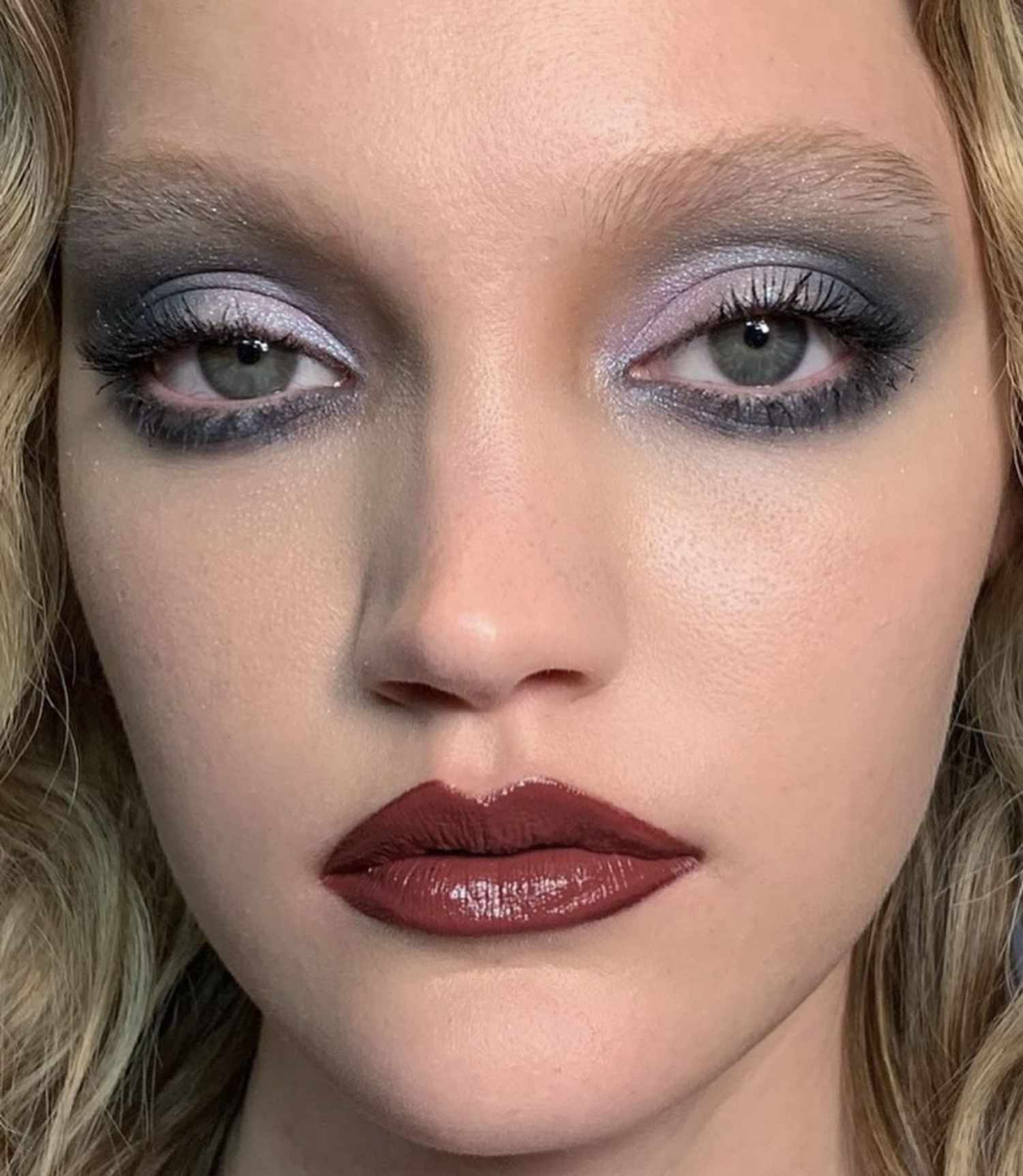 Close up of a model with smoky eyes and a cranberry lip