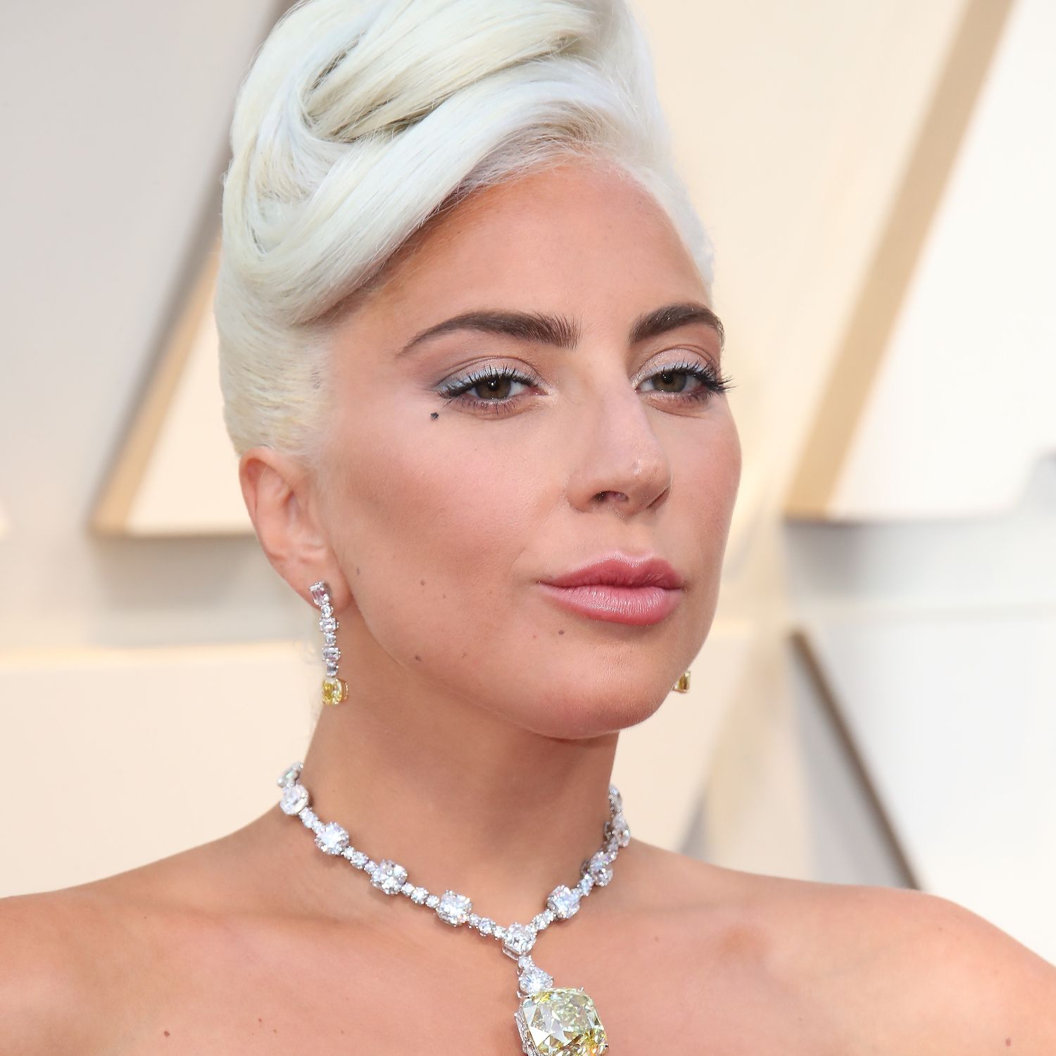 Lady Gaga wears a platinum blonde updo and the Tiffany diamond to the 2019 Oscars