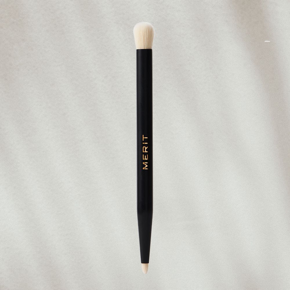 Double-Sided Eyeshadow Brush on textured background