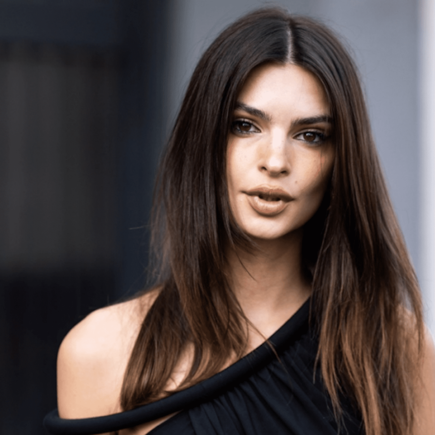 Emily Ratajkowski wears long, tousled hair with ghost layers