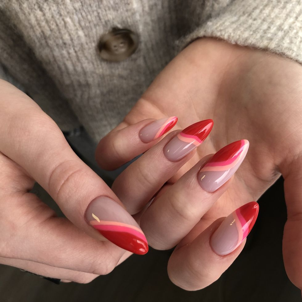 multicolored manicure close up young woman hands with pastel manicurebright multi colored design of manicure