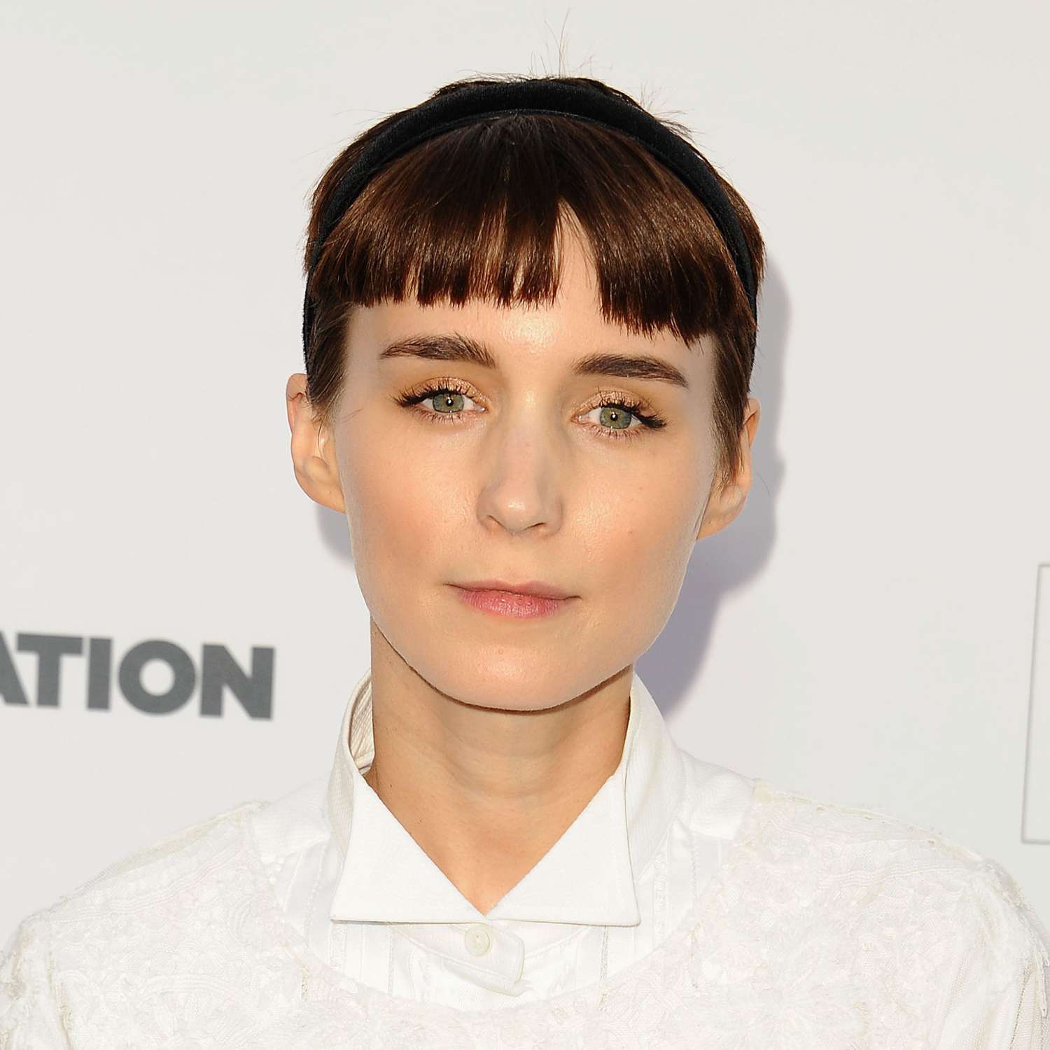 Rooney Mara wears an updo hairstyle with baby bangs