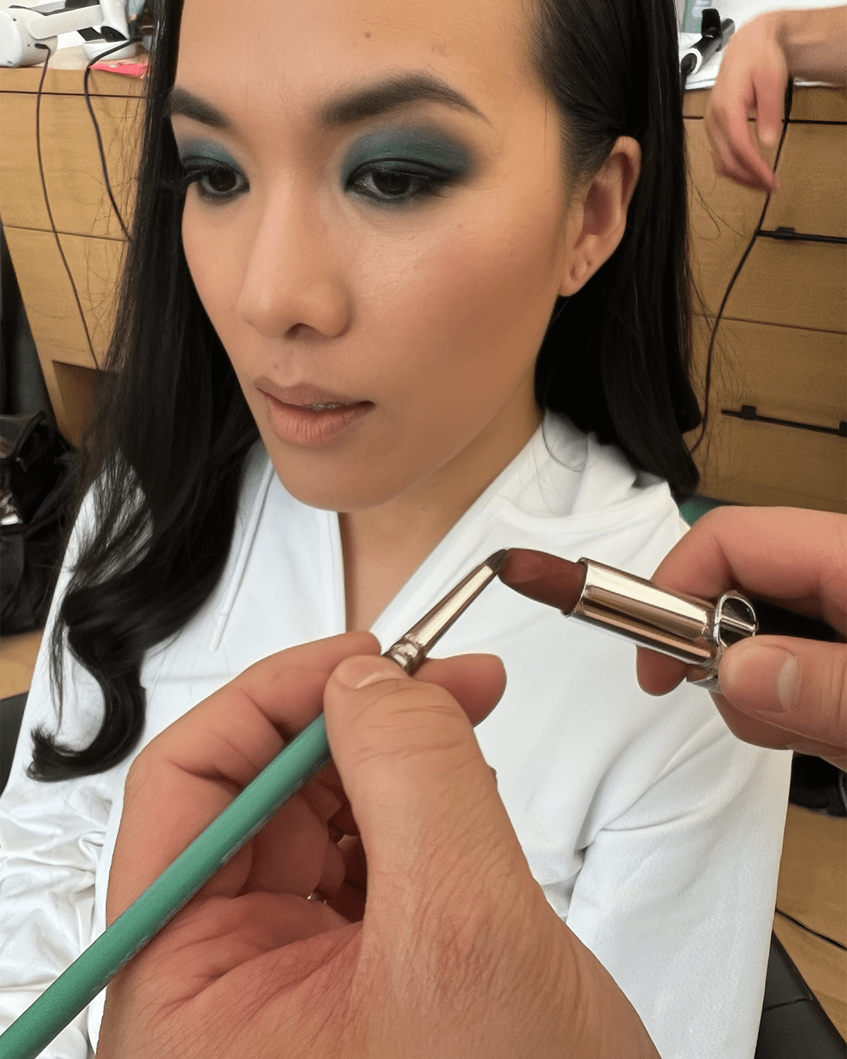 Ali Wong getting her makeup done for the 2024 Emmys