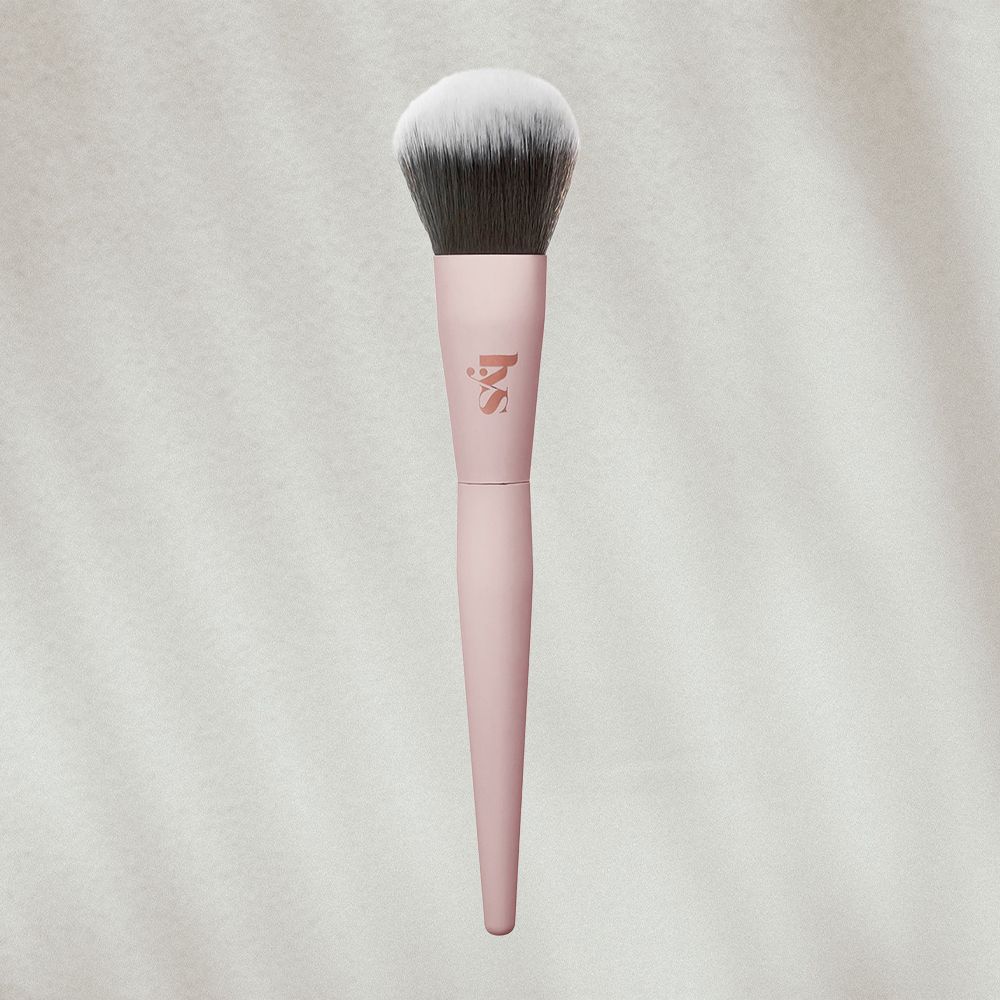 LYS makeup powder brush on textured background