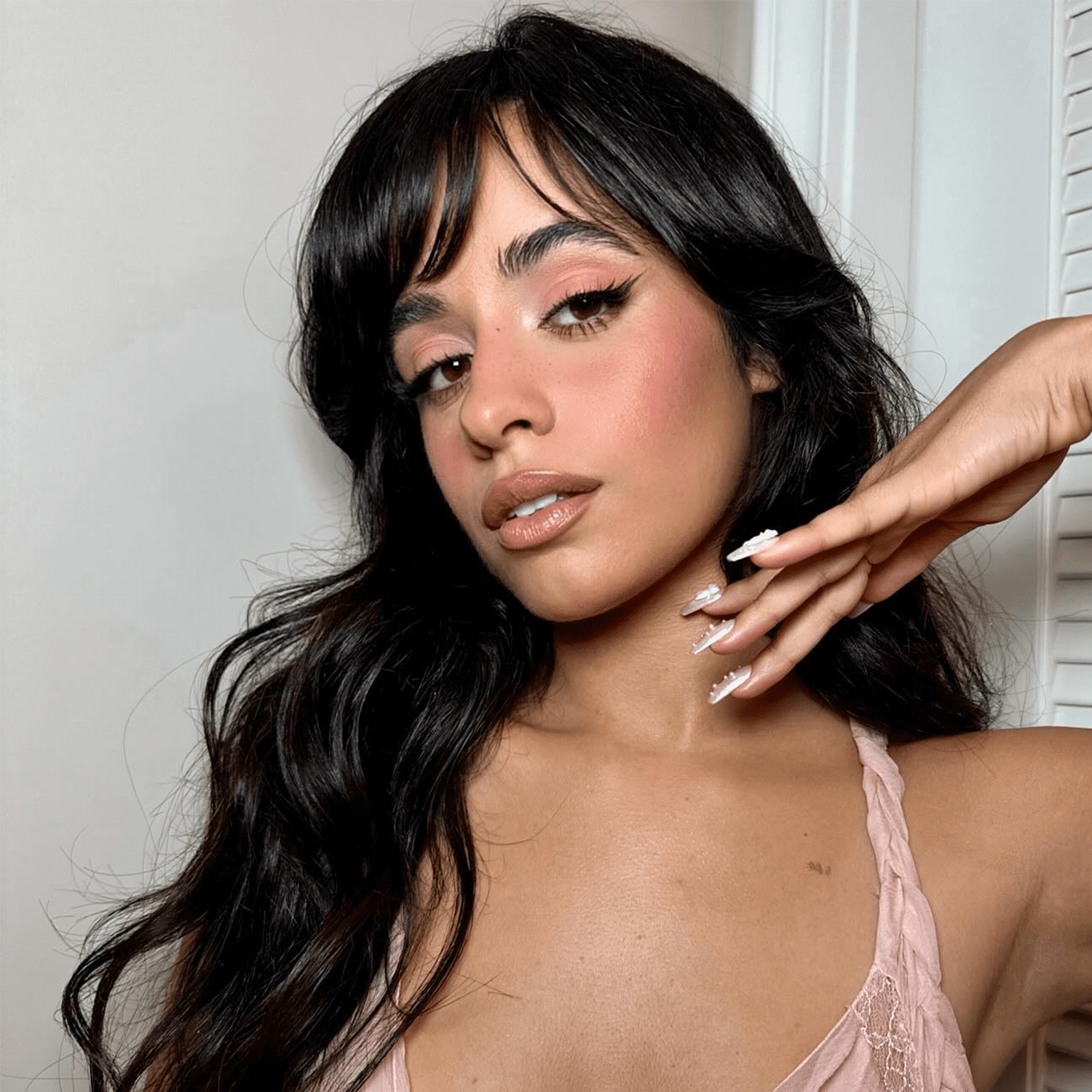 Camila Cabello wearing pink makeup and nude lipstick