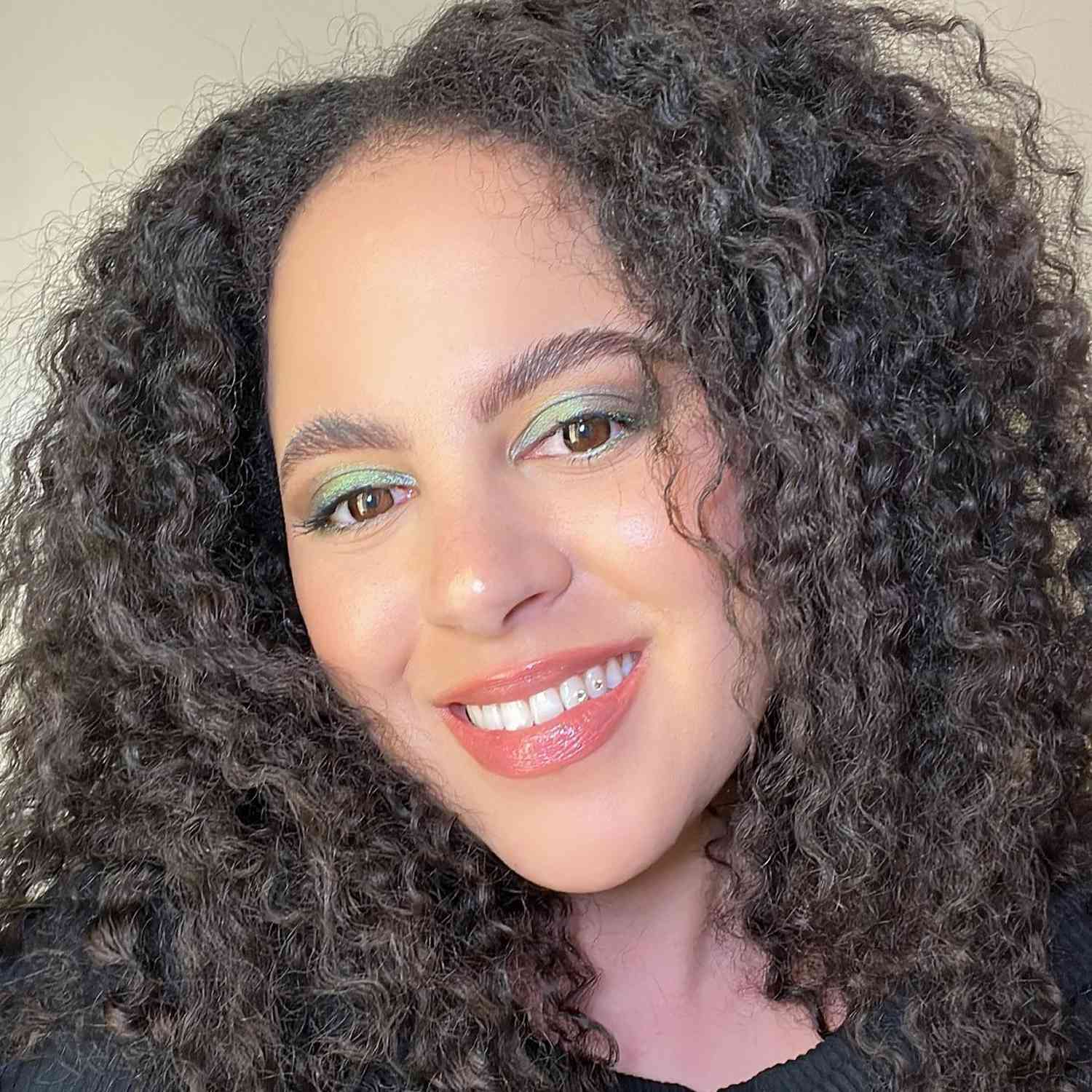 Close up of Byrdie associate social media director Star Donaldson in green and brown matcha makeup