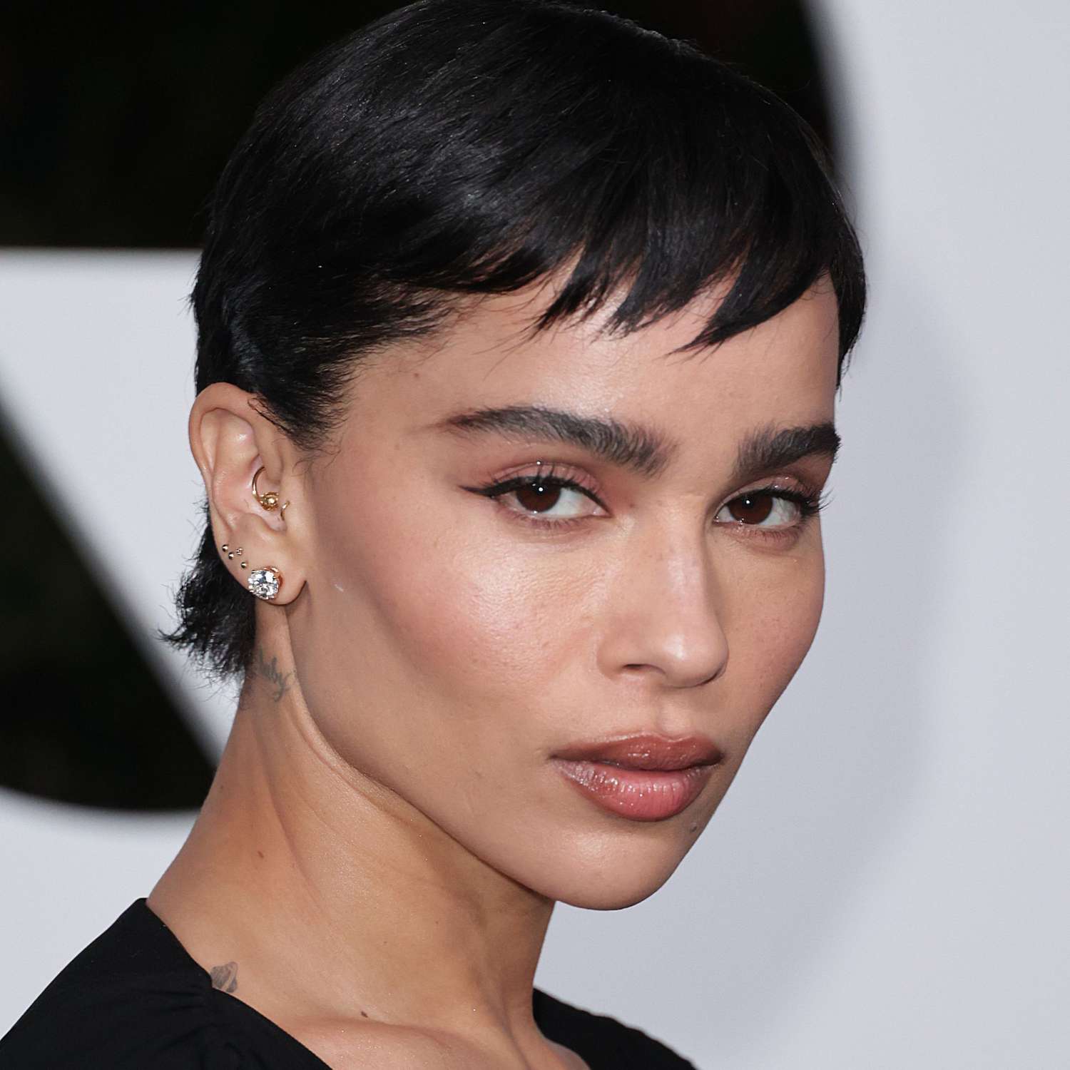 Zoe Kravitz wears a short hairstyle with micro bangs