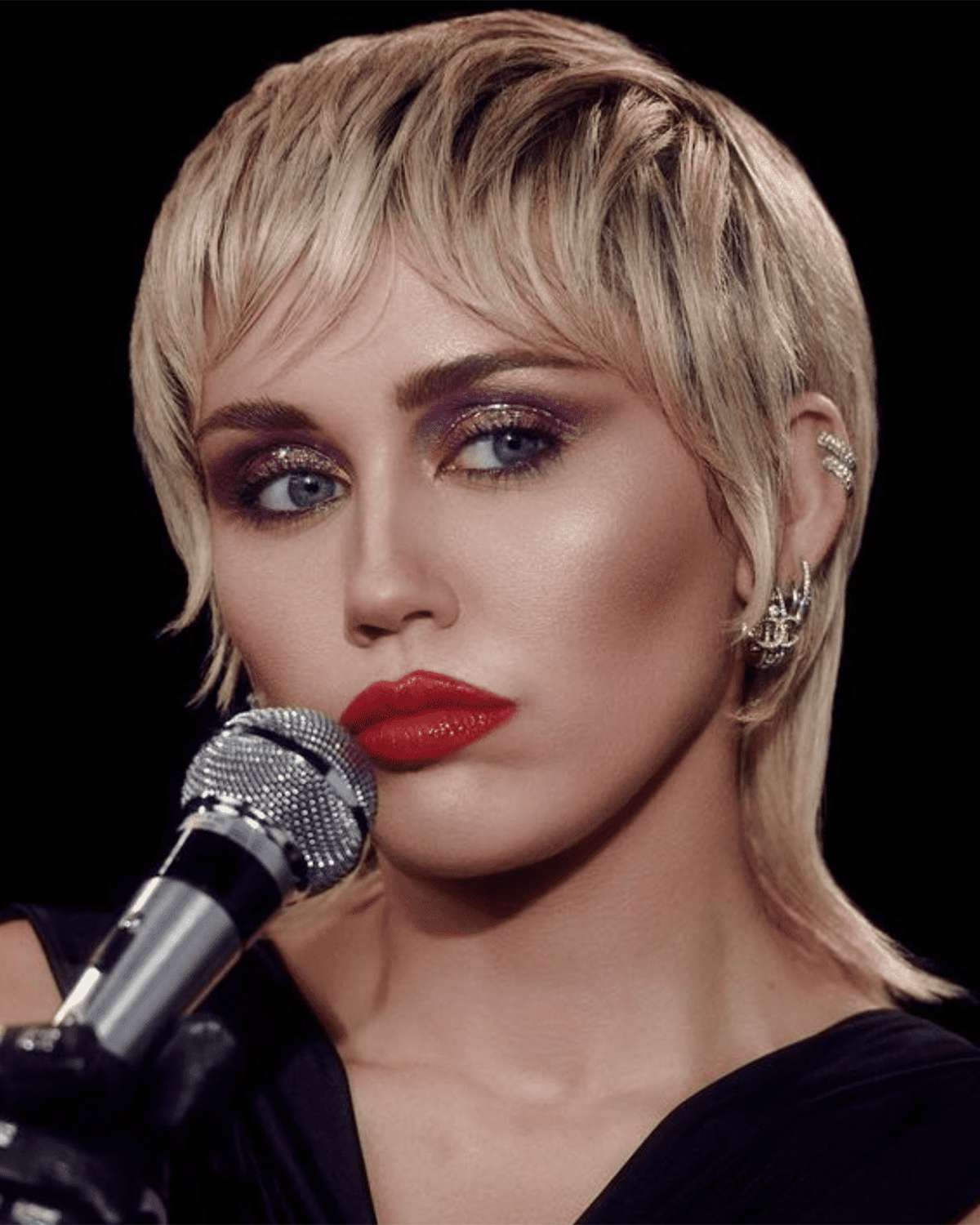 miley cyrus with a blonde mullet and red lipstick