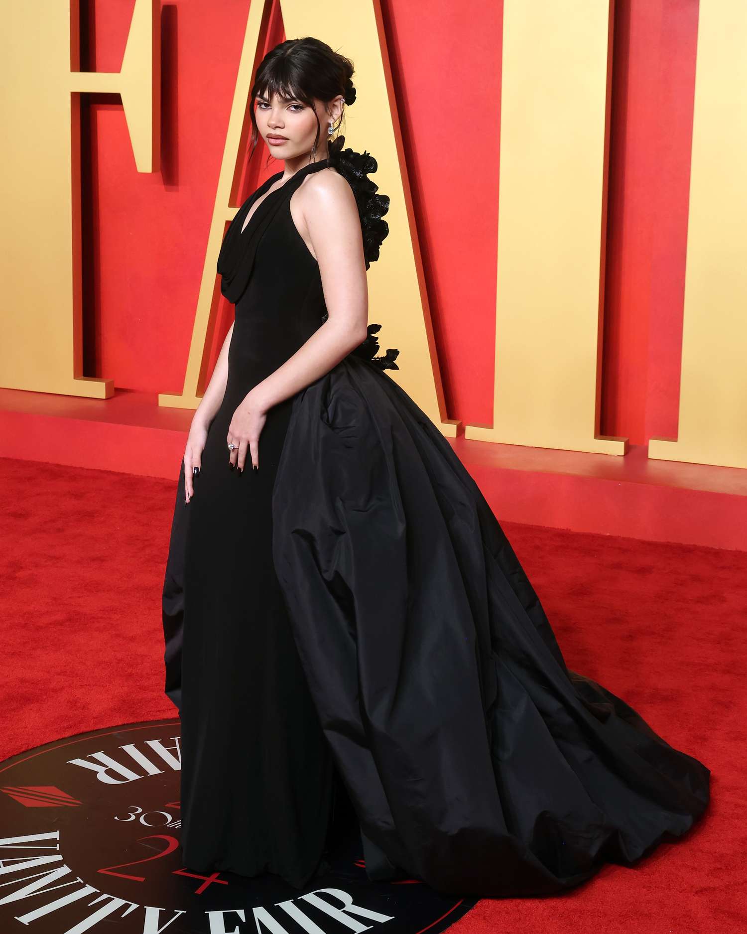 Ariana Greenblatt wearing a black gown at the 2024 Oscars