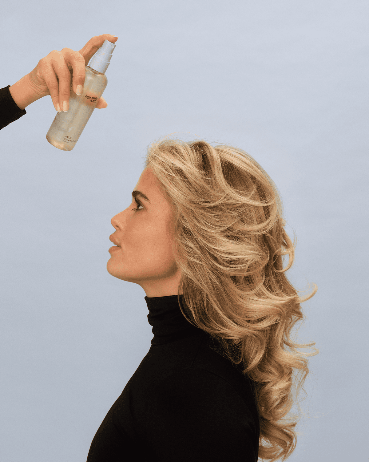 Matilda Djerf using her hair mist 