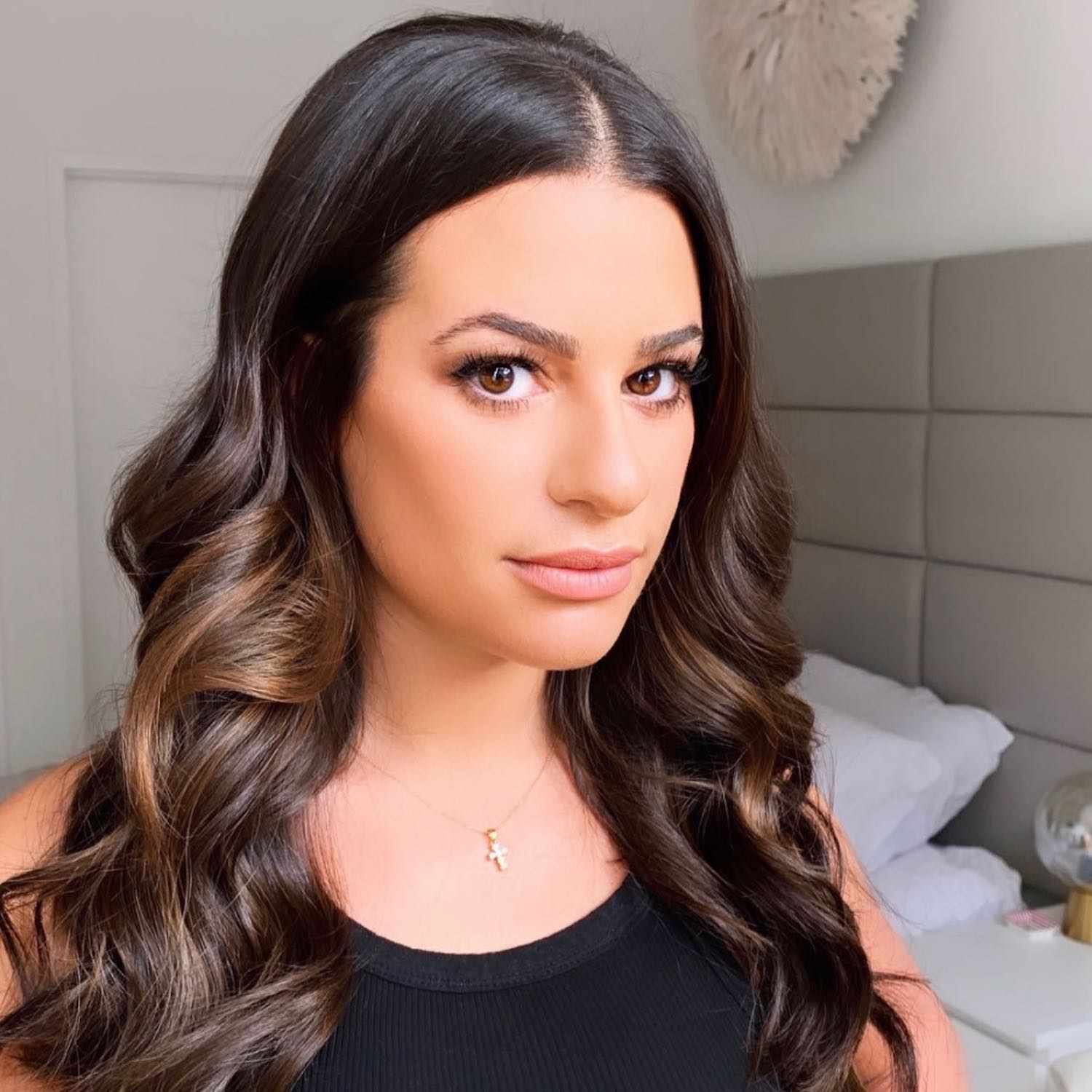 Lea Michele with long, curled hair with ghost layers