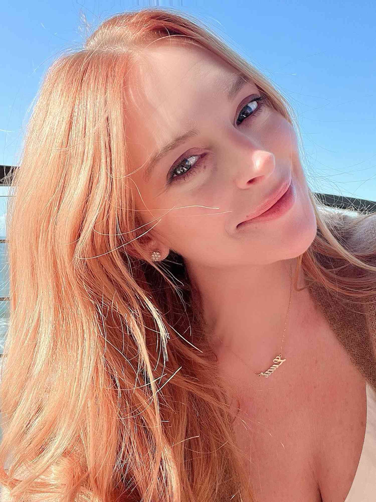Lindsay Lohan with peachy ginger hair and fresh, radiant skin