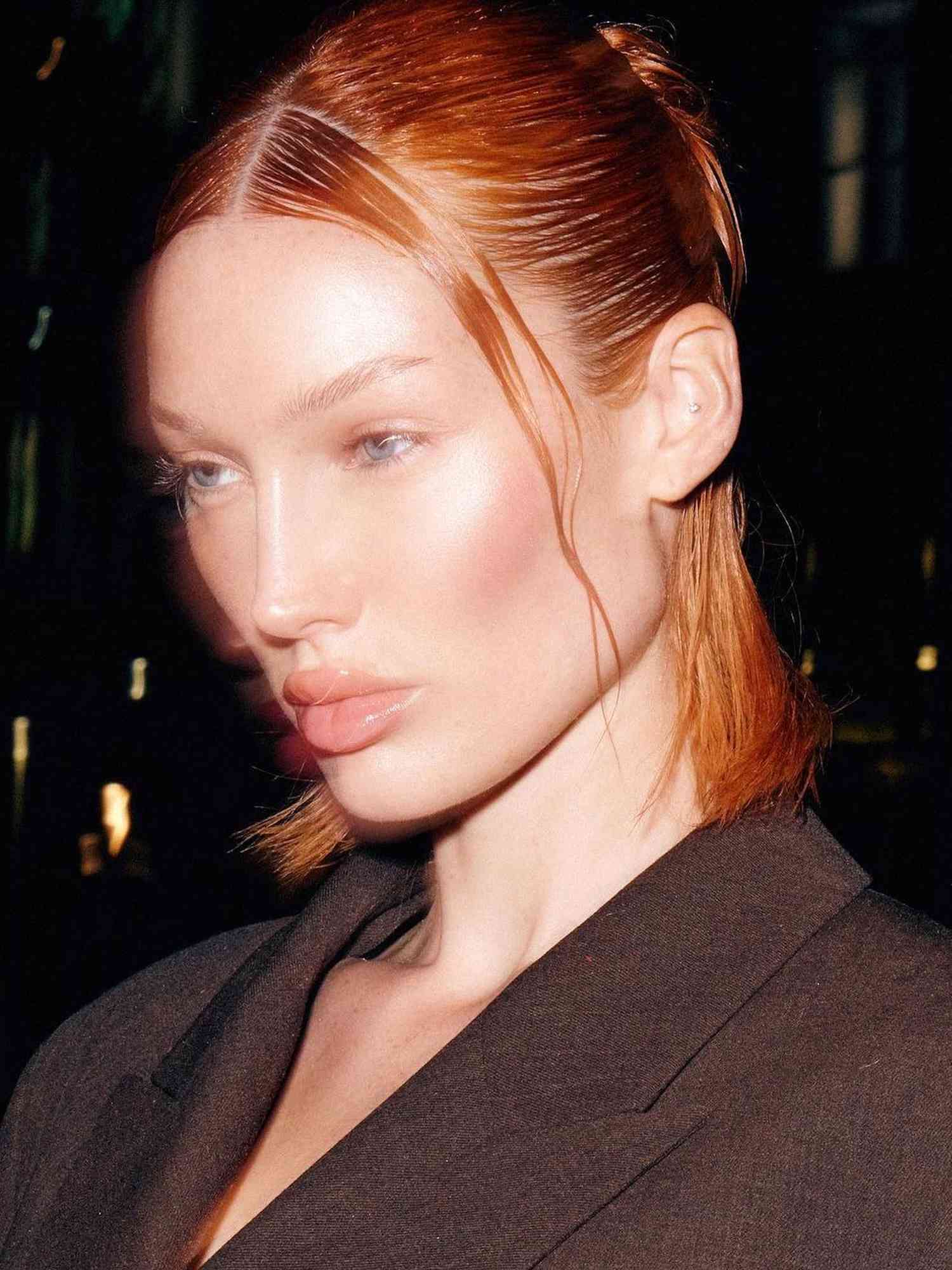 Meredith Duxbury with a ginger long bob hairstyle with wet-look half-up style