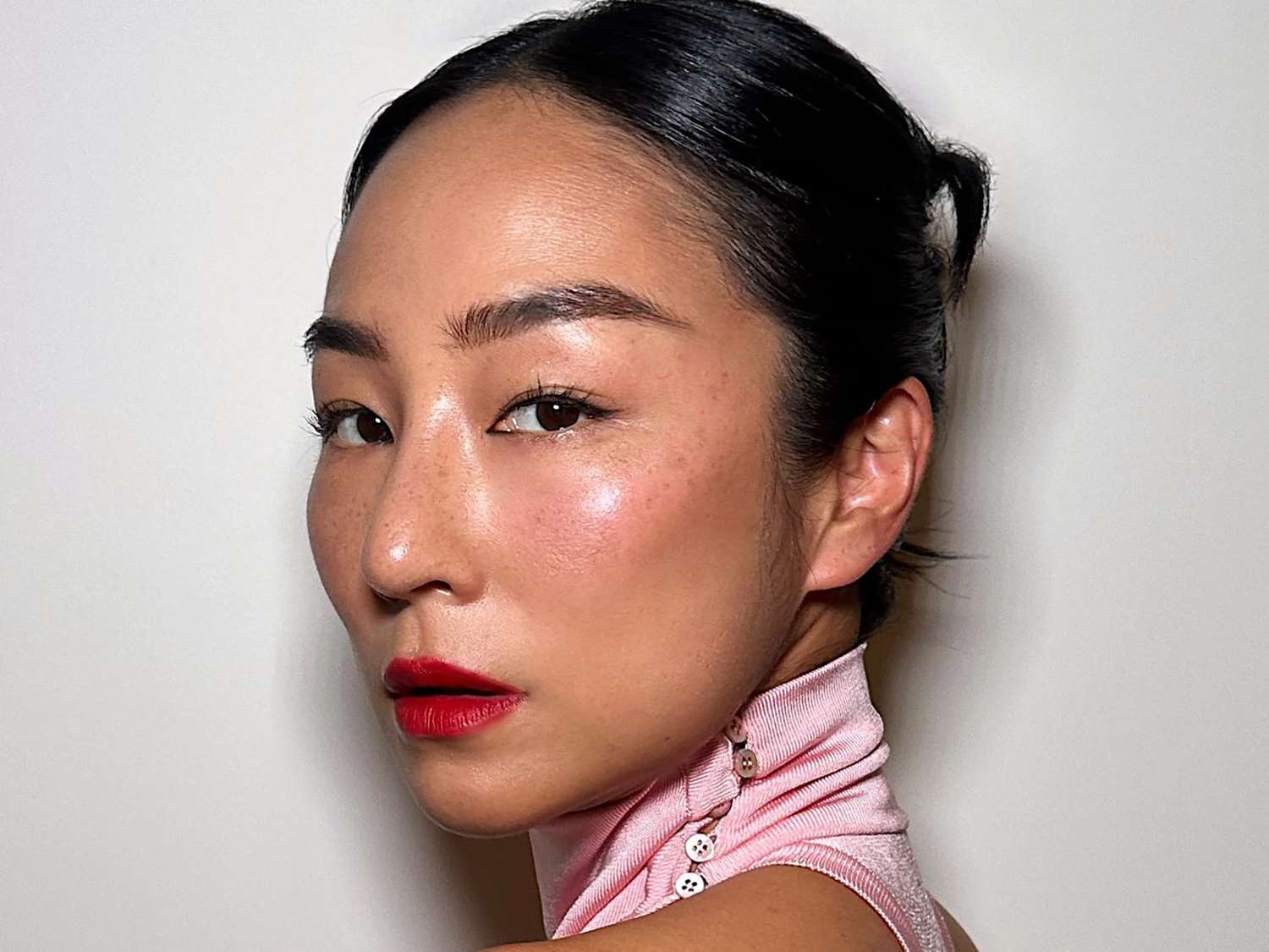Actor Greta Lee with glowy, perfectly applied makeup