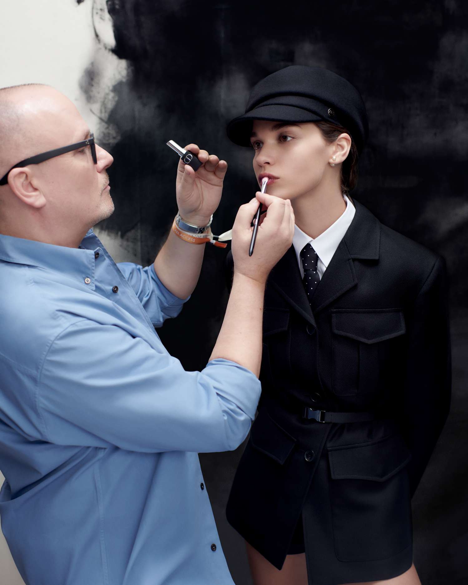 Peter Philips applying makeup to a model at the Dior show