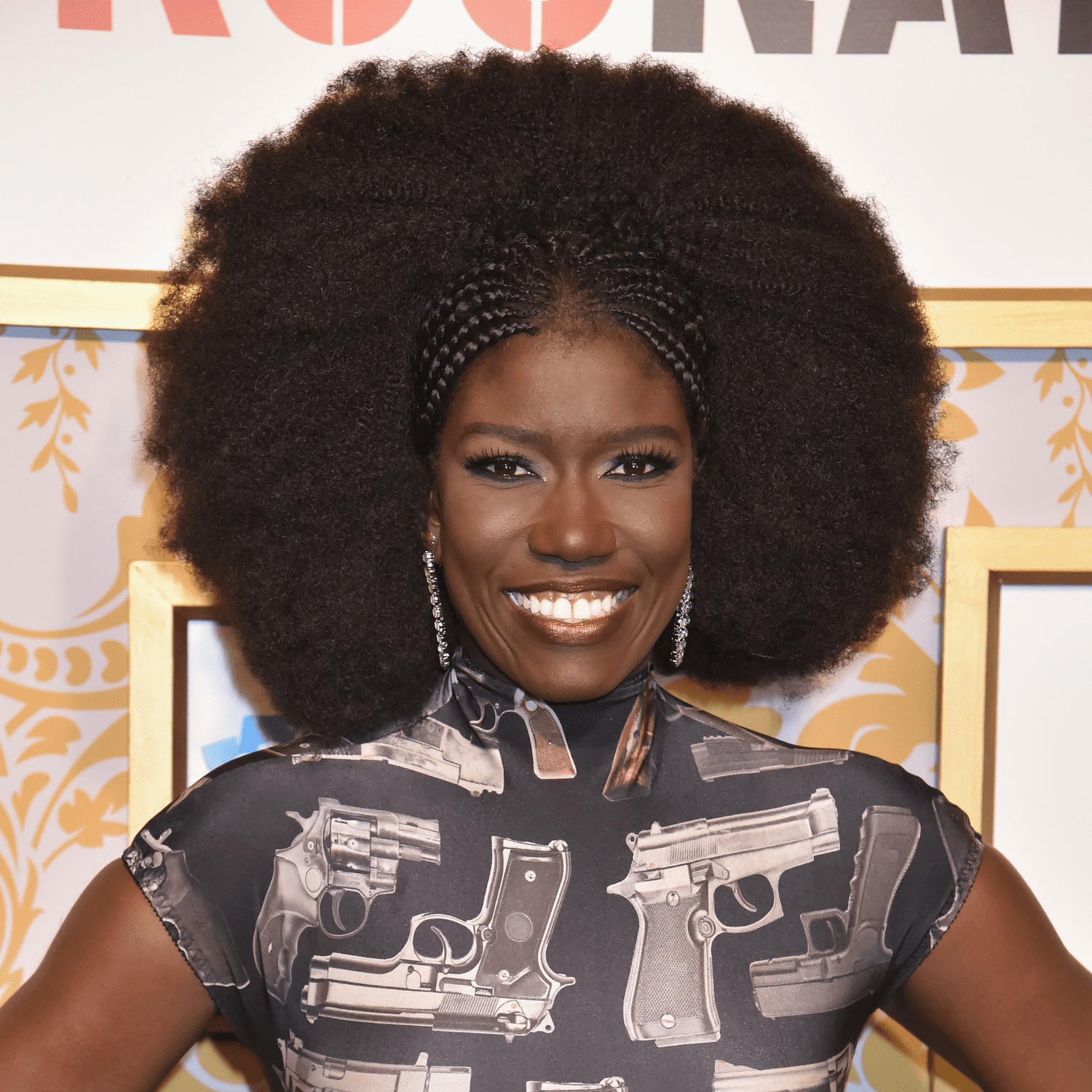 Bozoma Saint John wearing cornrows and an afro hairstyle