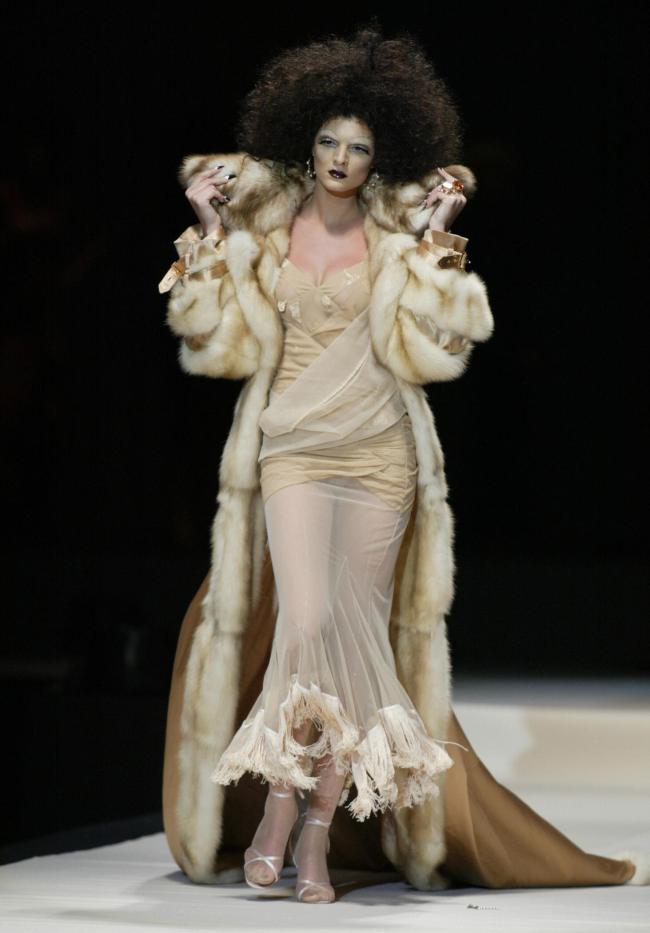 A model displays a creation by Christian Dior as part of the Spring/Summer pret-a-porter 2004 collection during Dubai's Fashion Week 08 February 2004, held on the sidelines of the affluent Gulf emirate's one-month shopping festival.