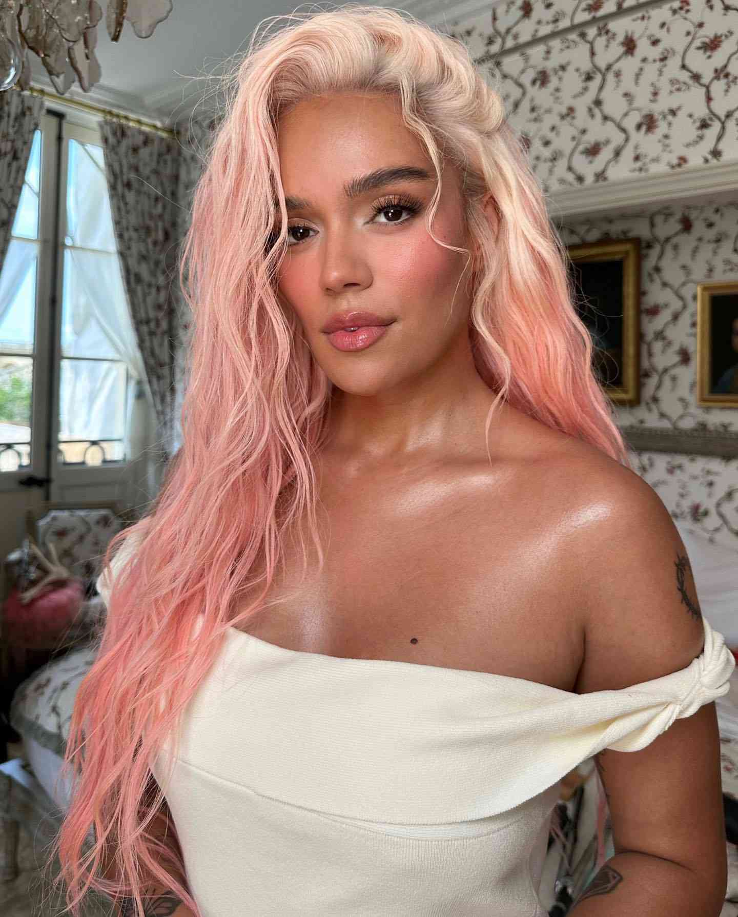 Karol G with pink hair