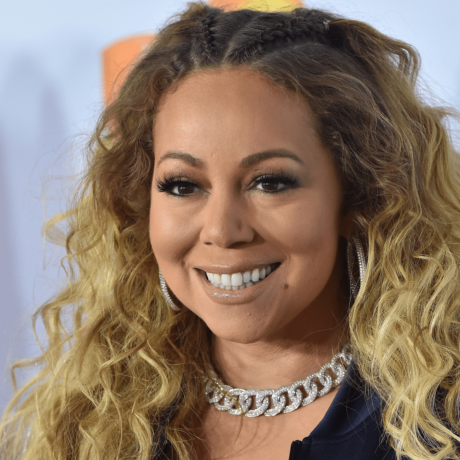 Mariah Carey wearing long curly hair with feed in braids hairstyle