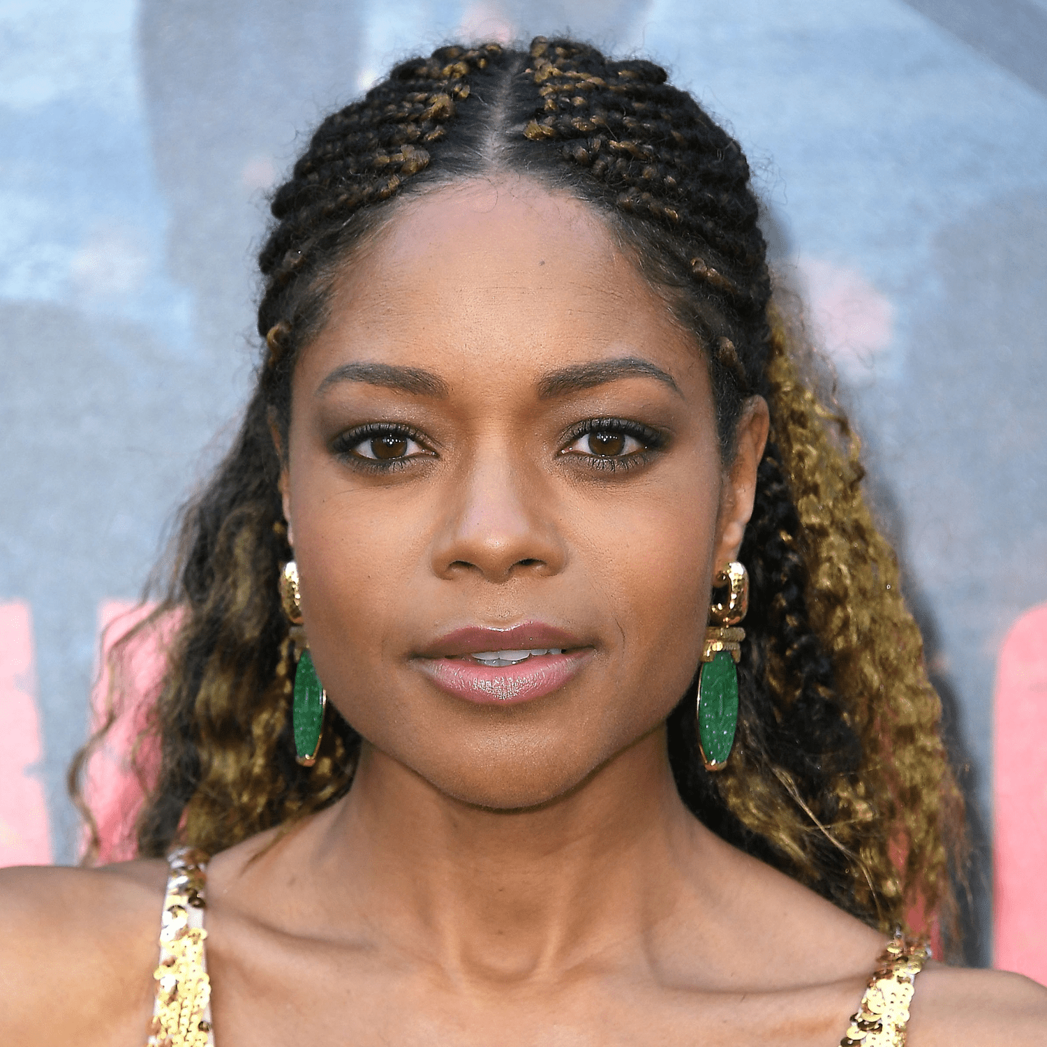 Naomie Harris wearing cornrows and curls on natural hair