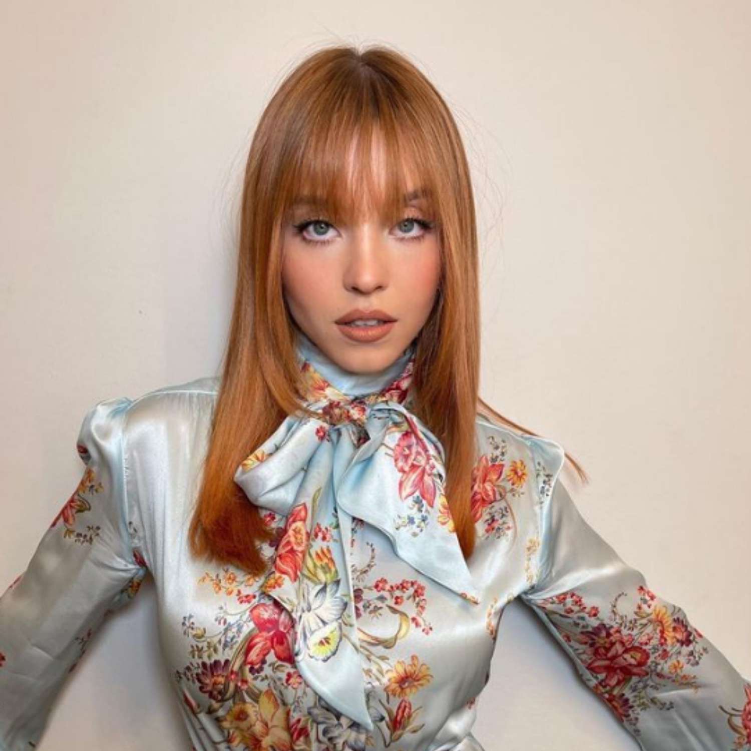 Sydney Sweeney with classic auburn hair.