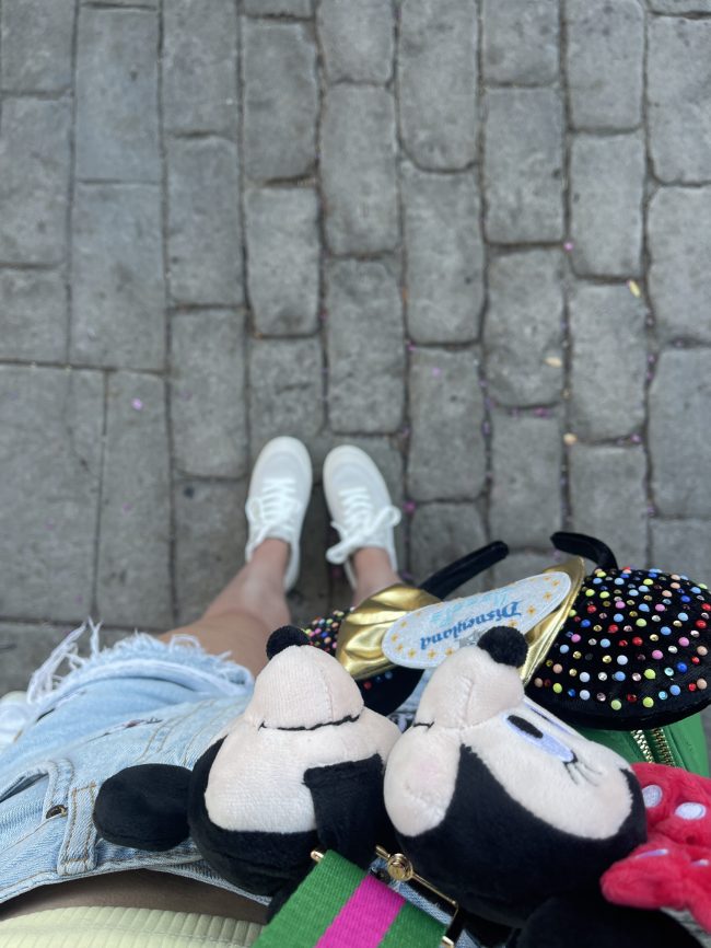 An image of white sneakers on brick floor 