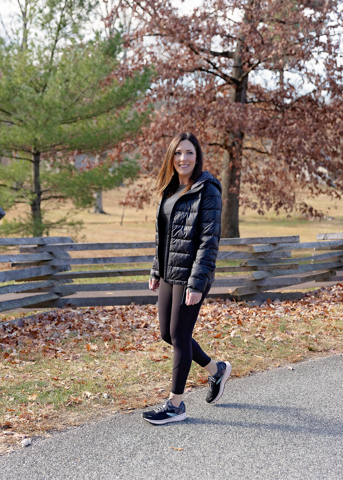 Jo-Lynne Shane wearing the Athleta Aire Puffer Jacket and Momentum Seamless Top with Rainier High Rise Leggings 