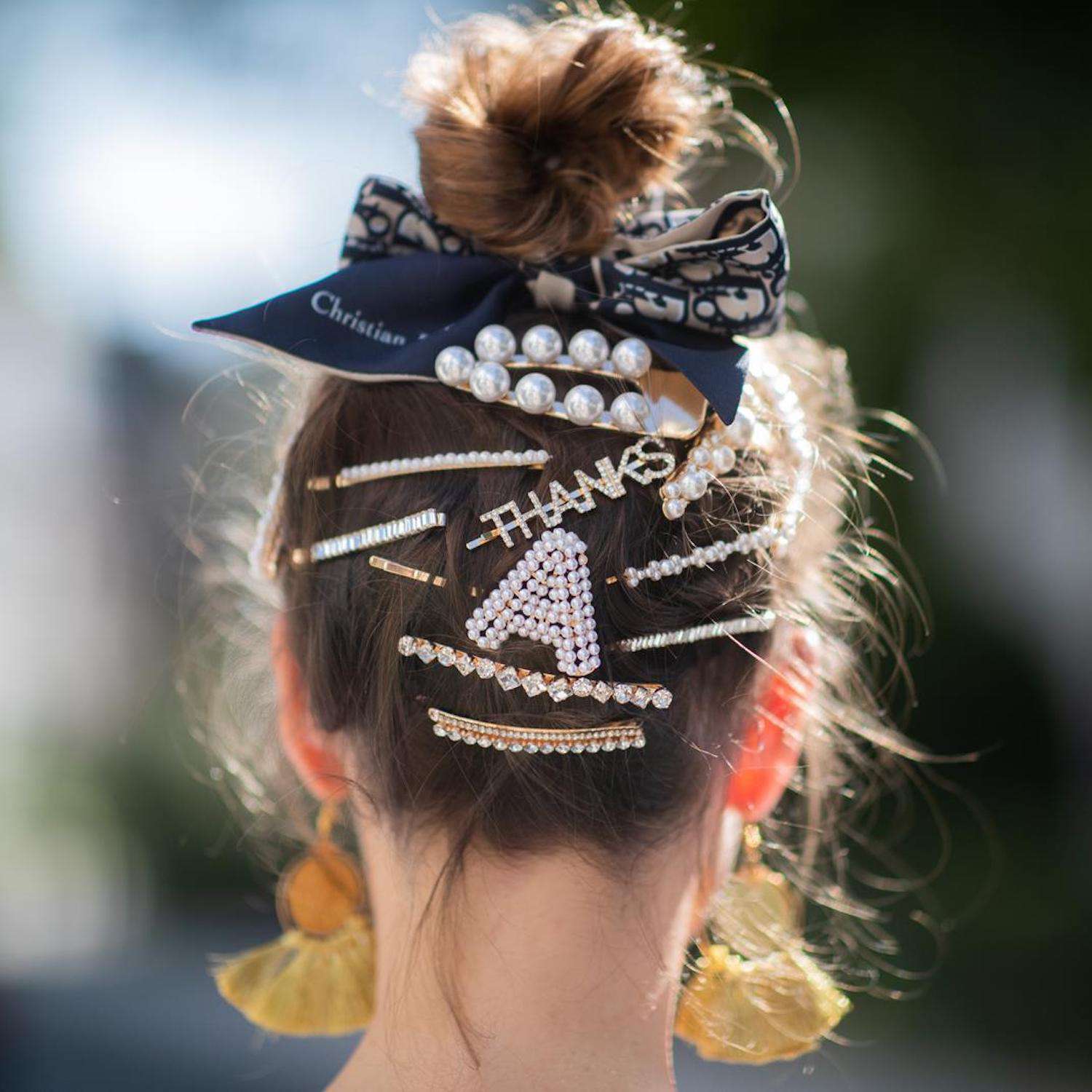 hair styled with multiple clips and bows