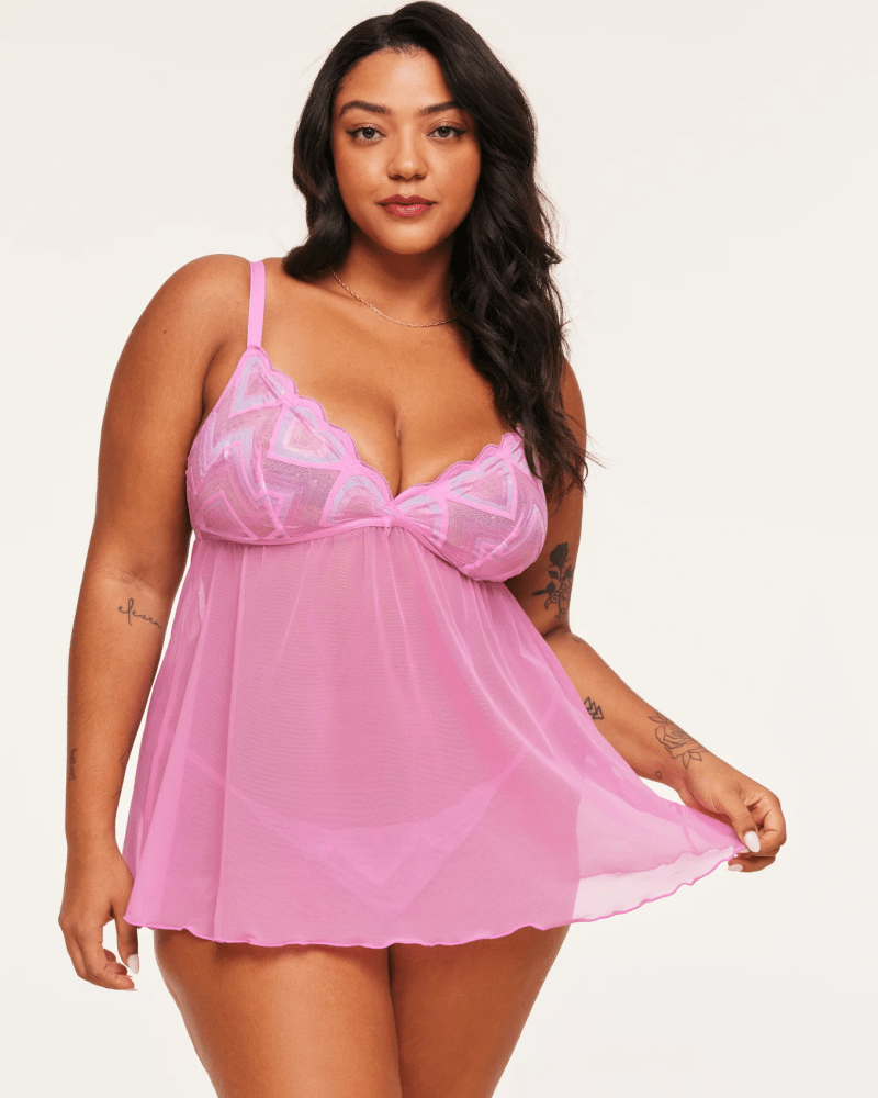 Adore Me model wearing a pink babydoll slip dress