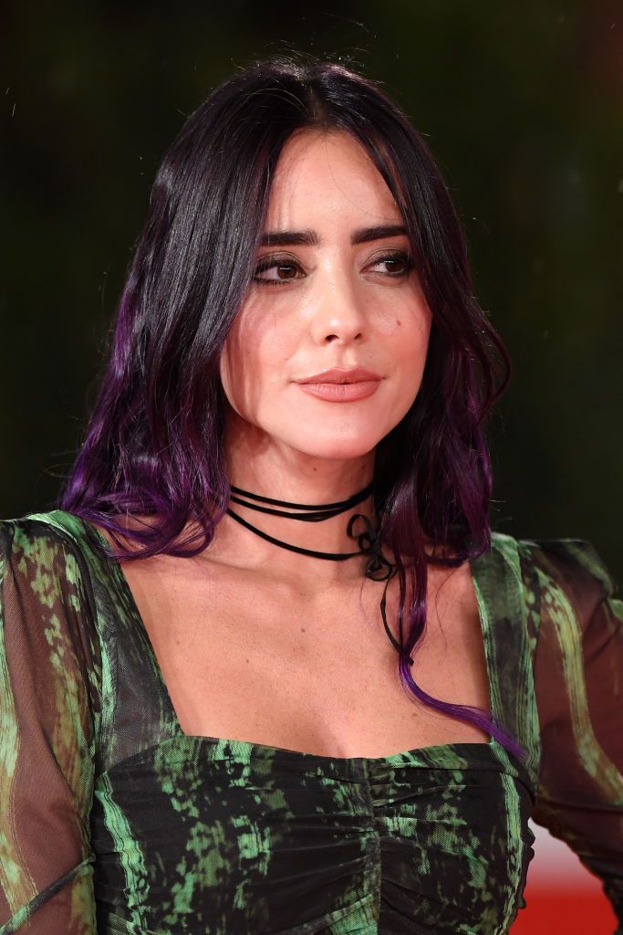 Giulia Penna with purple-tone hair.