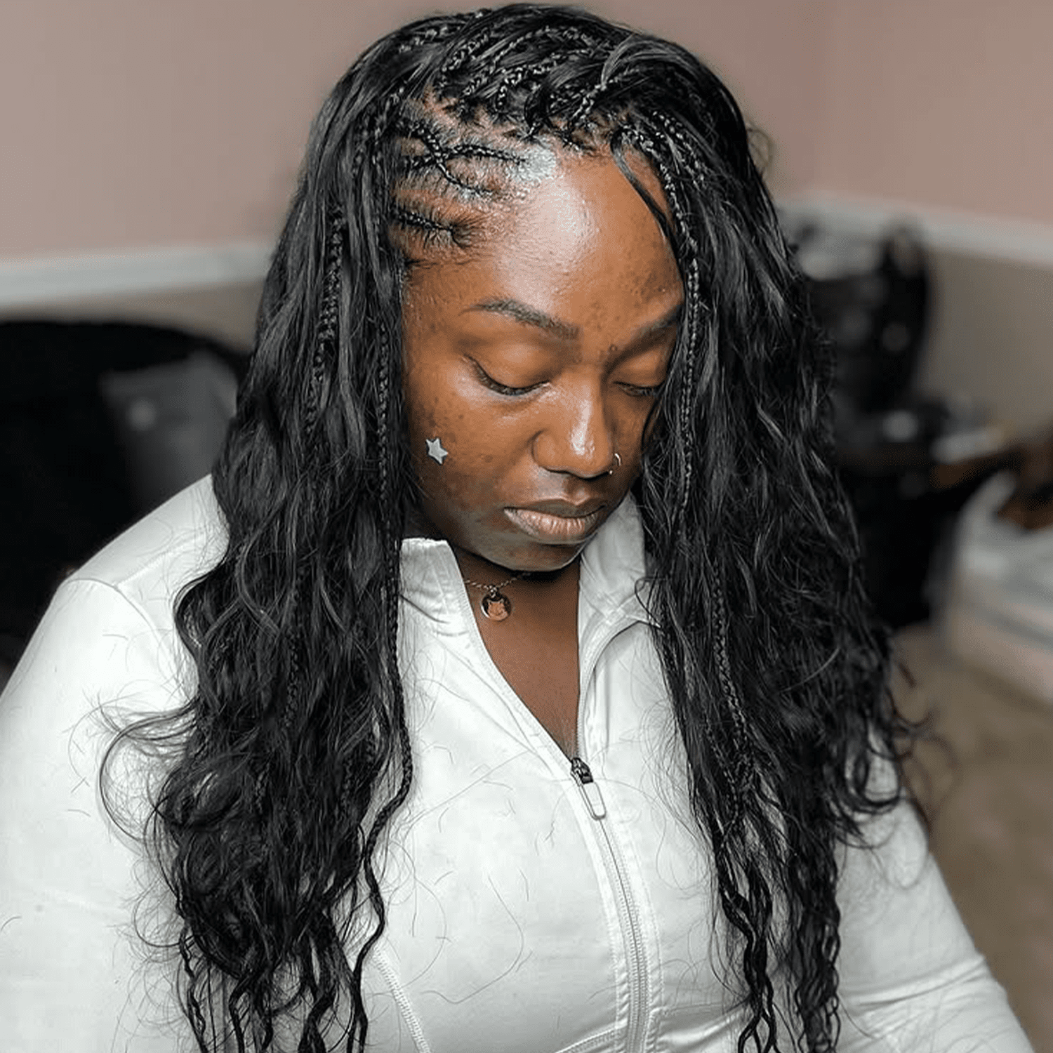 woman with flip-over fulani braids with curly pieces