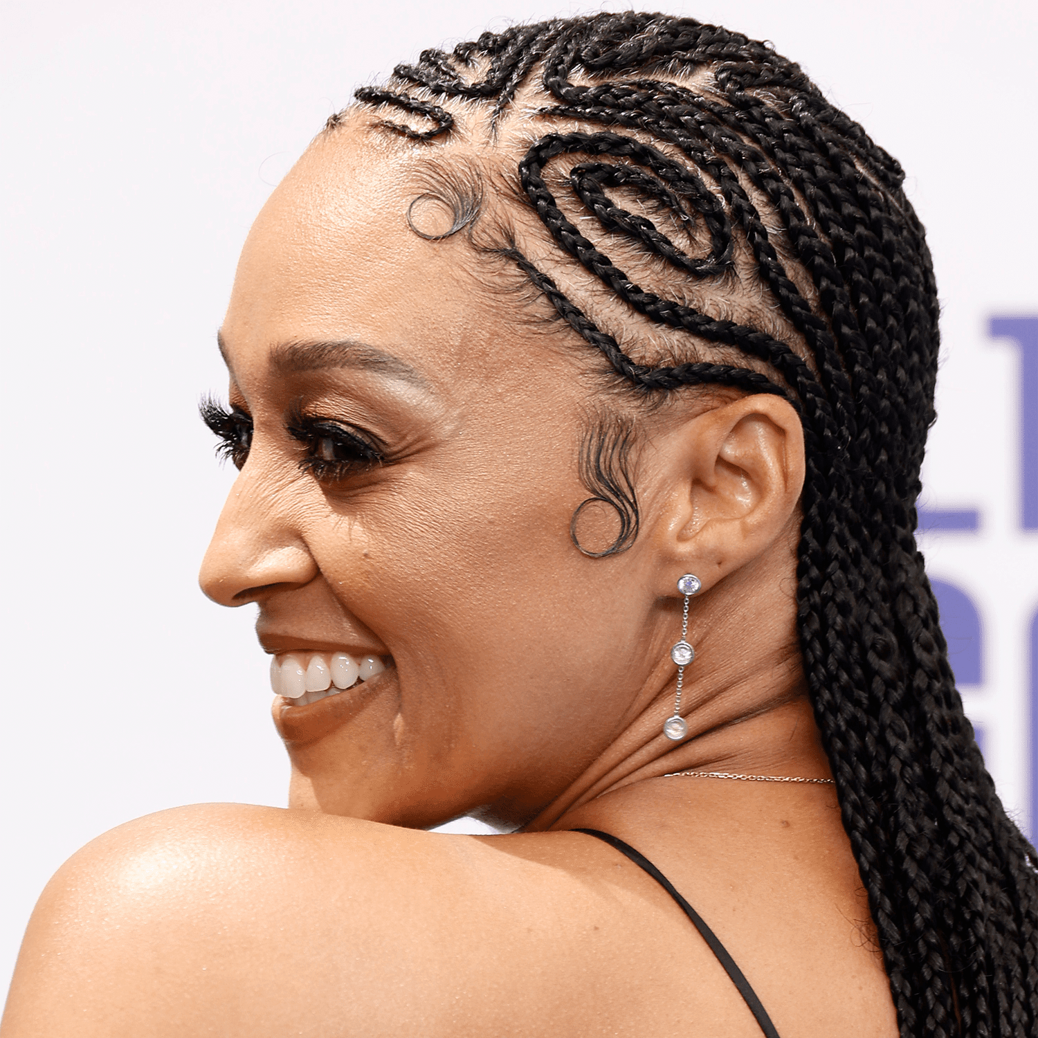 Tia Mowry wearing freestyle cornrow