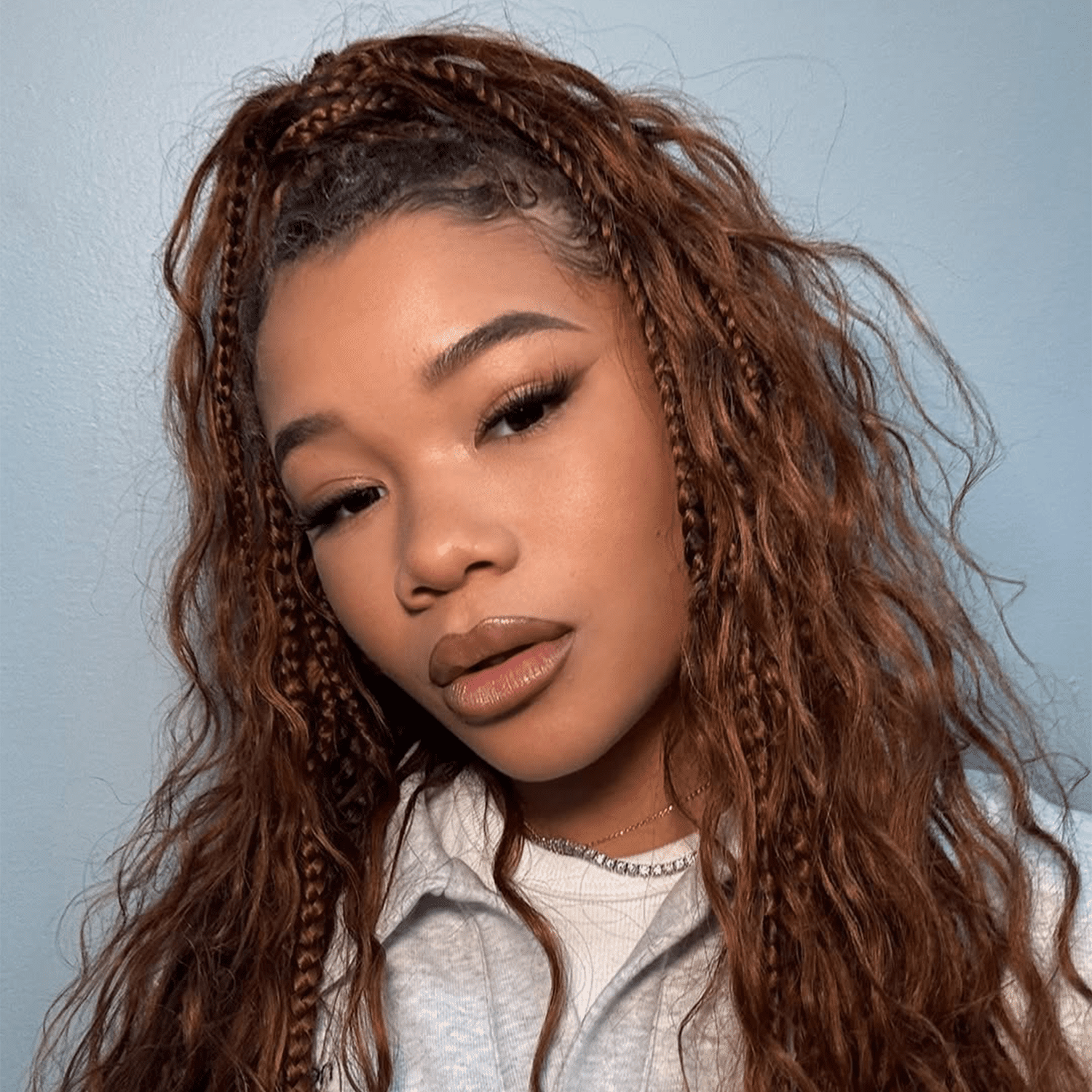 Storm Reid wearing copper goddess braids