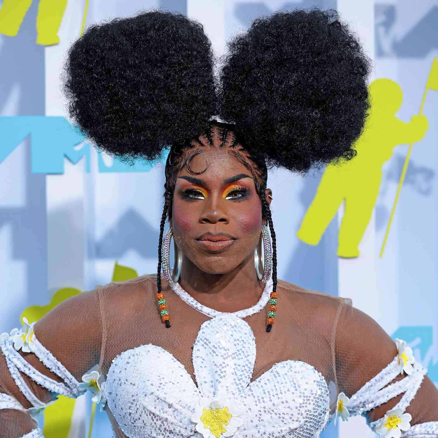 Monet X Change with two fluffy afro puffs