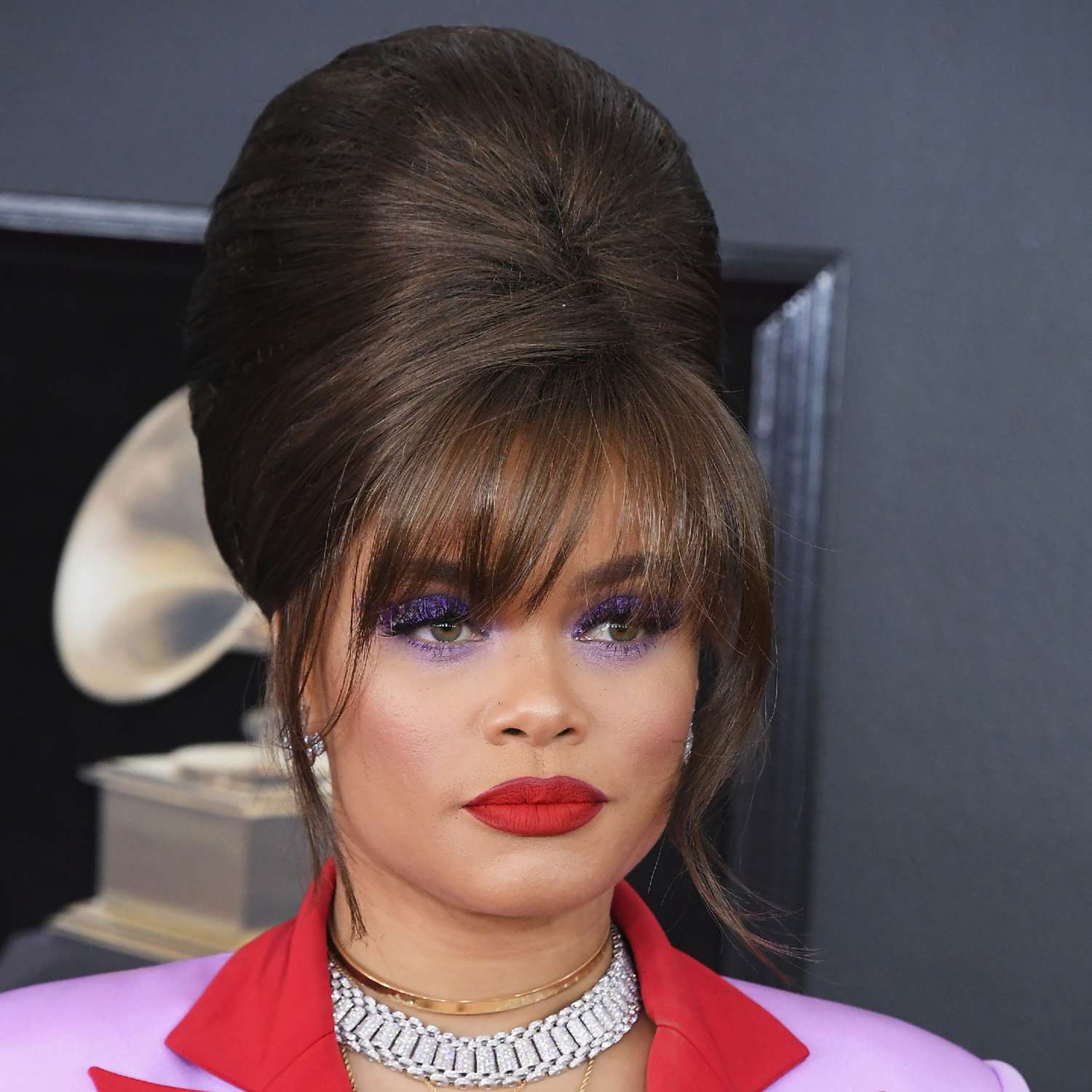 Andra Day with a beehive and wispy bangs