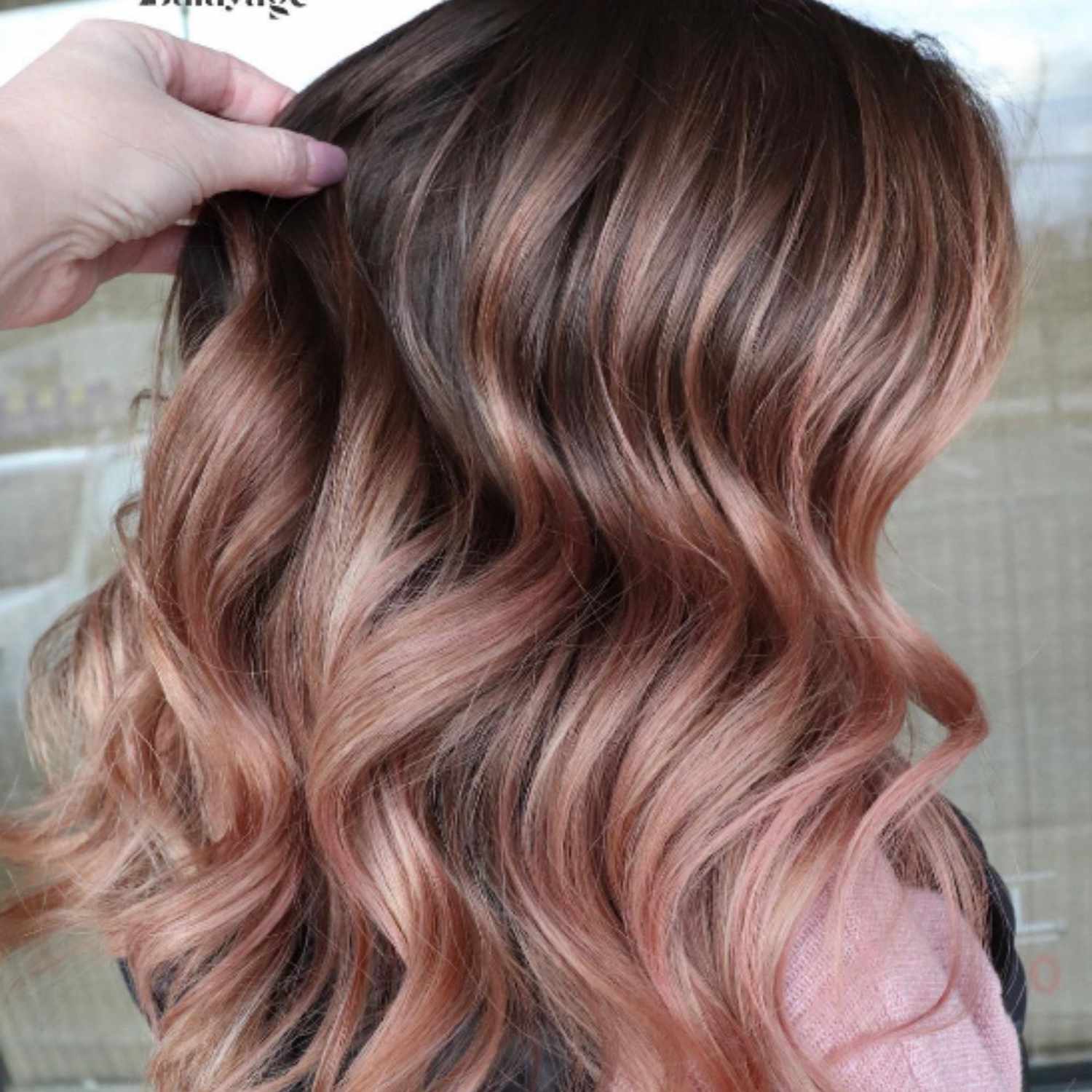 Brown balayage with a rose colored overlay.