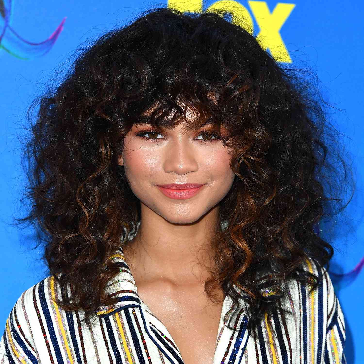Zendaya with a curly shag hairstyle