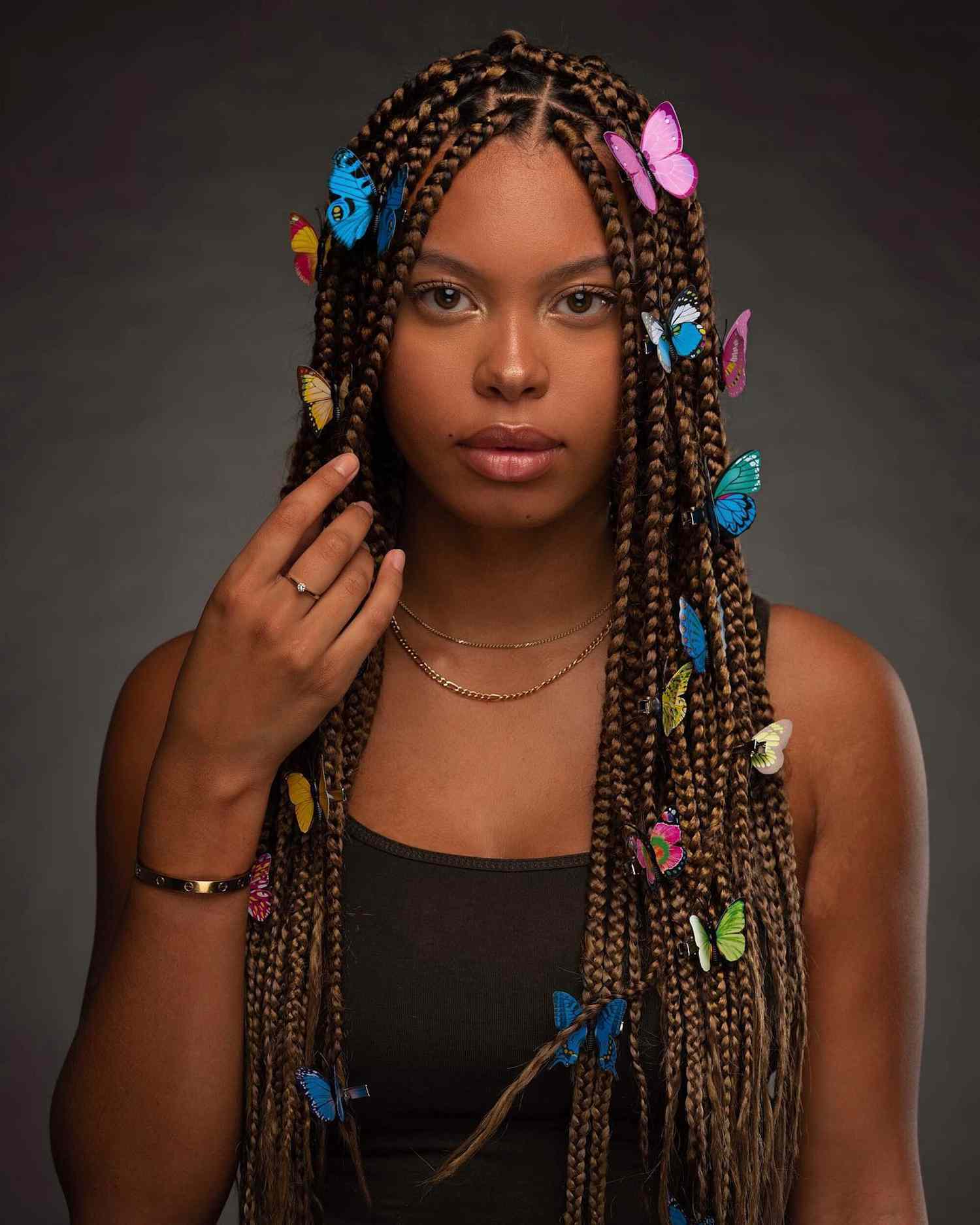 Woman with butterflies in her box braids