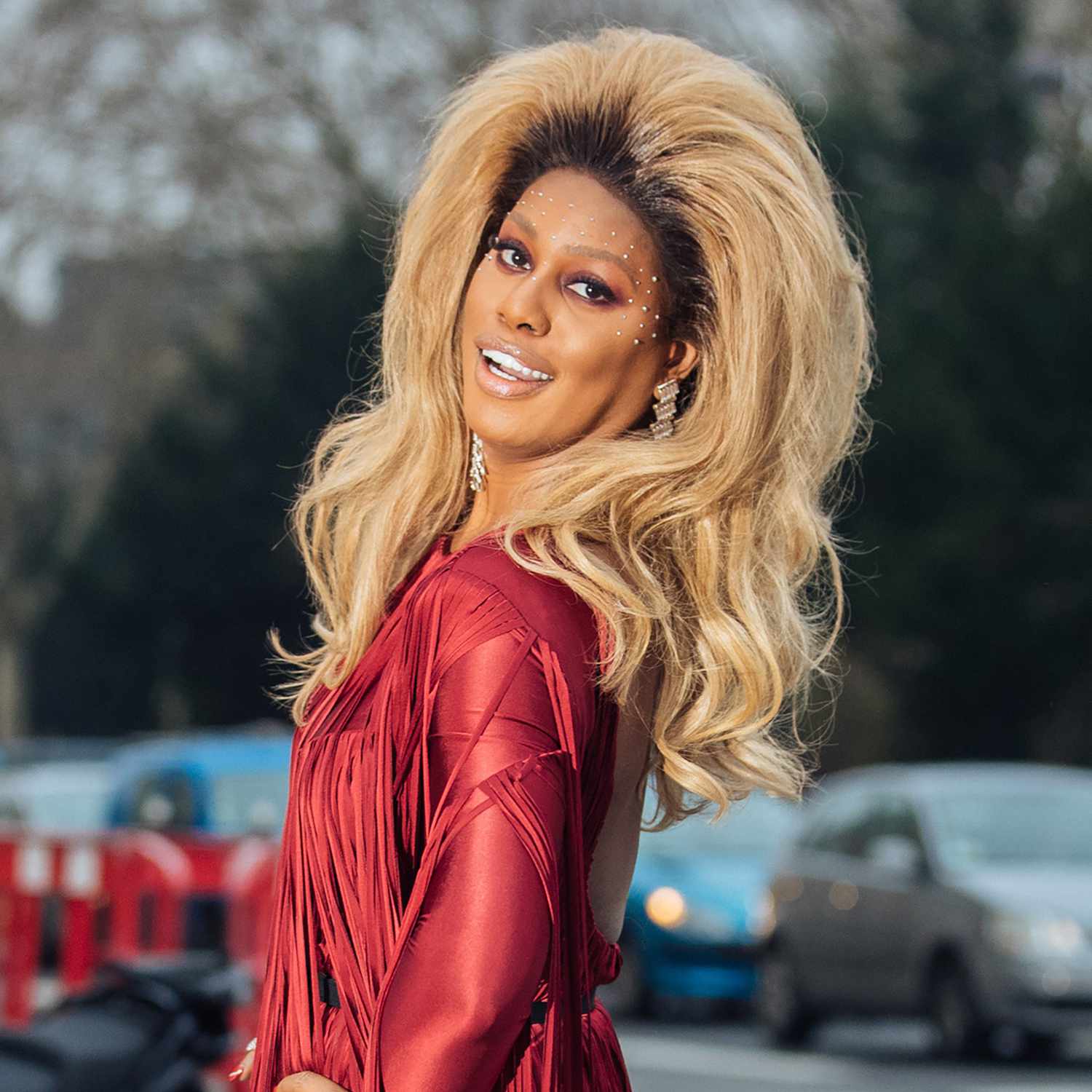 Laverne Cox with big, backcombed honey-blonde hair