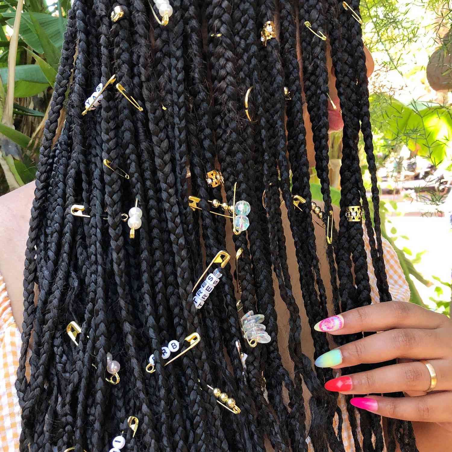 Box braids with safety pin and cuff accessories