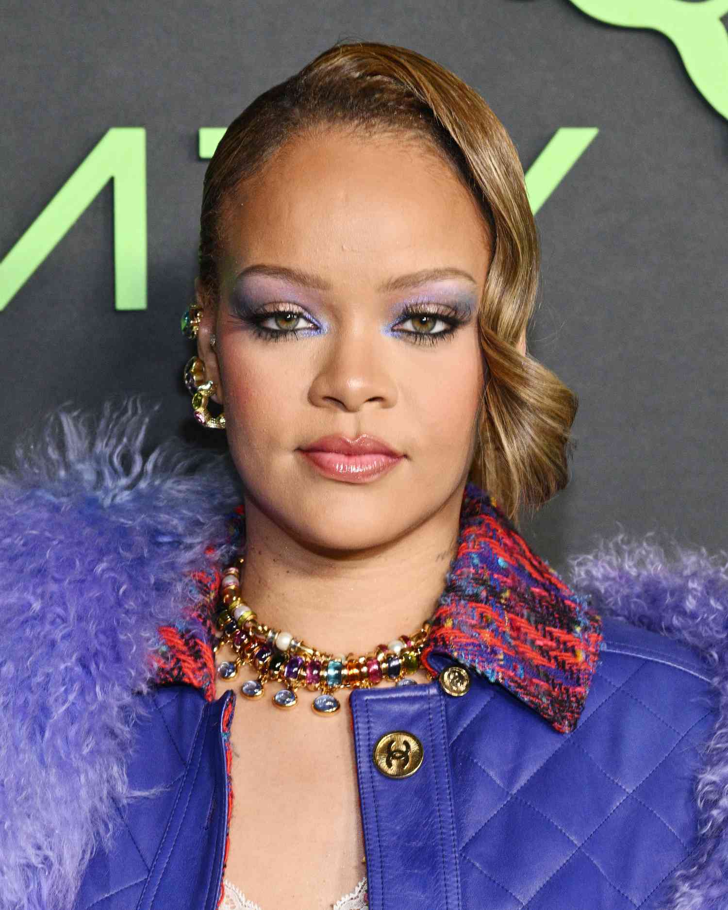 Rihanna with pale purple and blue eyeshadow accentuating her hazel eyes