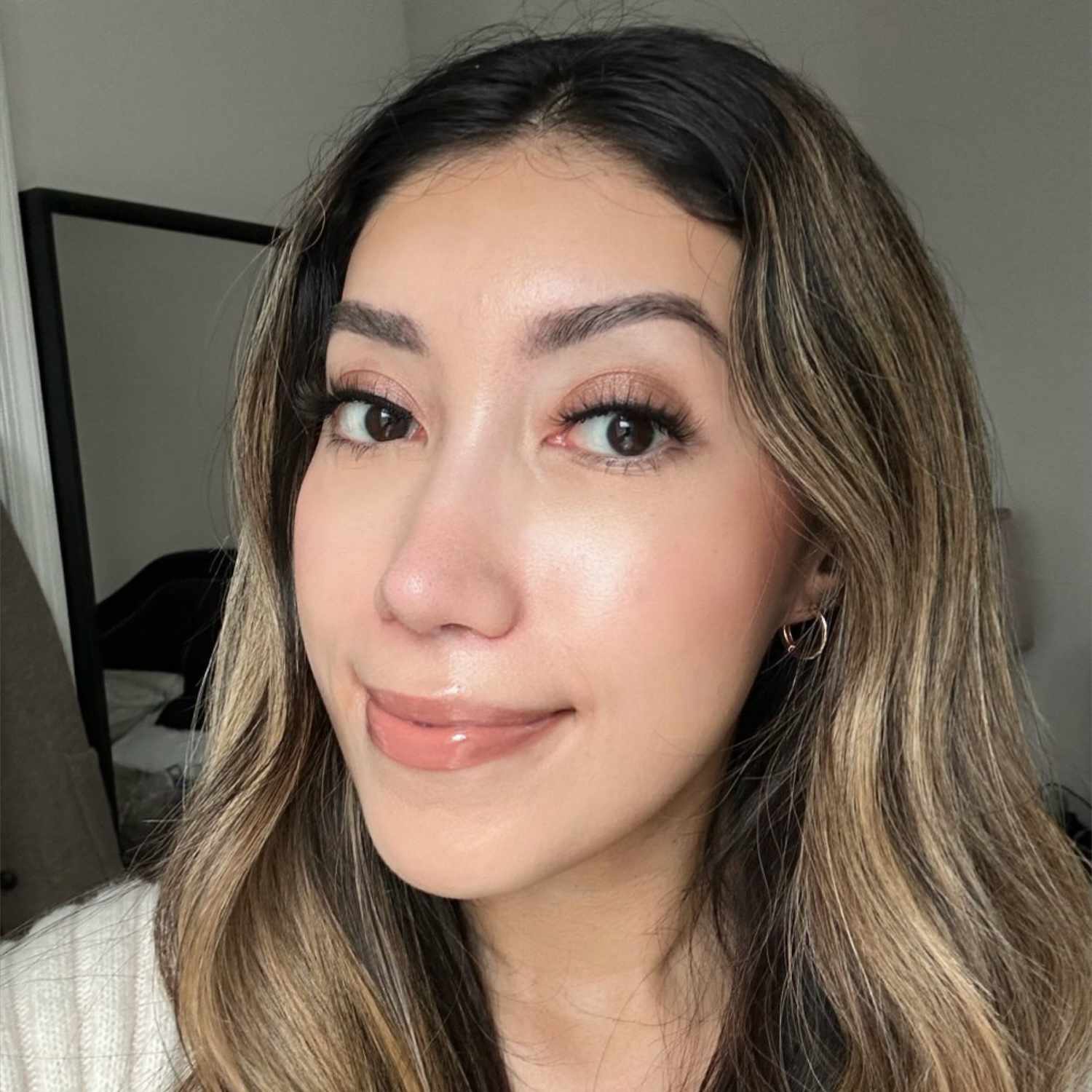 Byrdie writer Karla Ayala wears the Kiss My Lash But Better false lashes in style "Blessed"